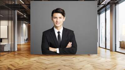 Happy smiling businessman with gray background. Wall mural