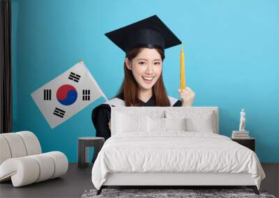 happy Young female graduation student showing the Korea flag Wall mural