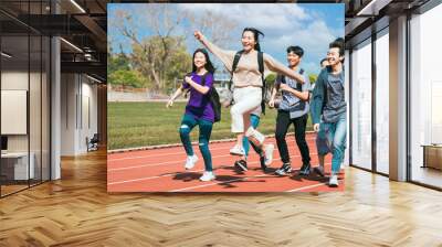 Happy young group students running Across Field Wall mural