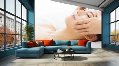 massage of face for woman in spa salon Wall mural