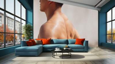 Rear view of muscular athletic young man Wall mural