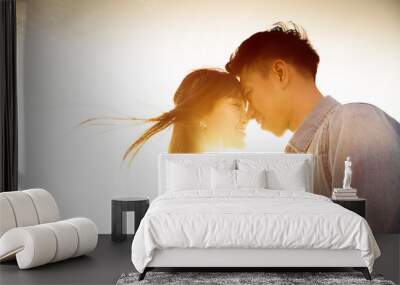 Smiling Couple in love with sunlight background Wall mural