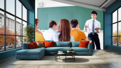 teacher with group of college students in classroom Wall mural