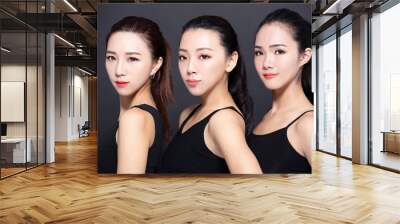 Three asian young beauty with black background Wall mural