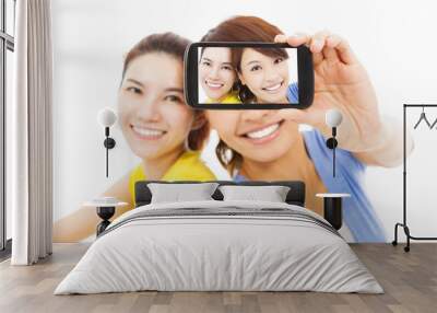 two happy young girls taking a selfie over white background Wall mural