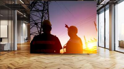 two worker watching the power tower and substation with sunset b Wall mural