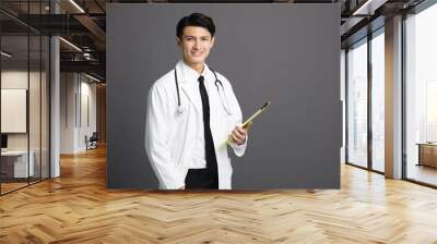 young smiling asian Doctor with stethoscope. Wall mural