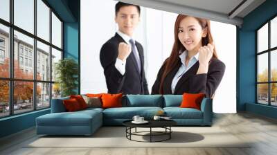 Young smiling business woman and business man Wall mural