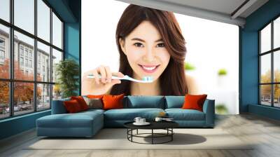 Young woman  brushing teeth in the morning Wall mural