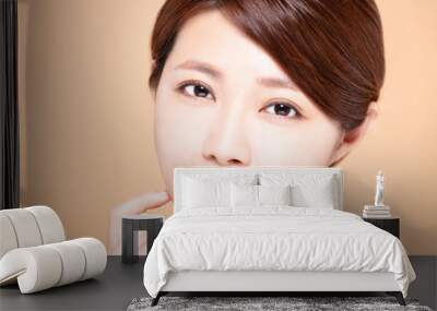 young woman with natural makeup and clean skin Wall mural