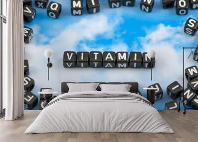 The word vitamin on the sky background Wall mural