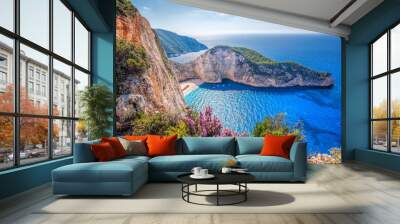 Navagio beach with shipwreck and flowers against sunset on Zakynthos island in Greece Wall mural