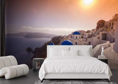 Oia village with churches against Aegean sea on Santorini island in Greece Wall mural