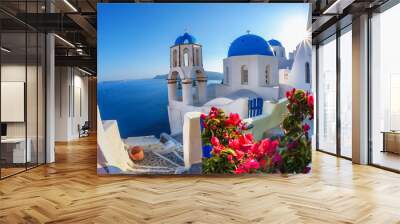 Santorini island with church against  sunset in Oia, Greece Wall mural