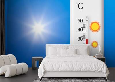 Celsius scale thermometer shows plus xx degrees . Yellow sun in blue sky. Summer heat Wall mural