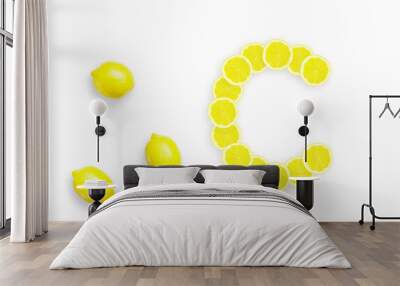 Lemon is a natural source of vitamin c . Alphabet letter C made from yellow lemons. Wall mural