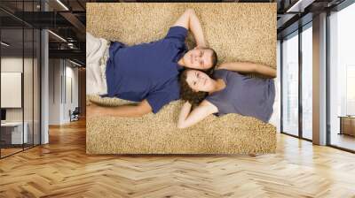 young couple on beige carpet Wall mural