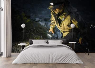 Emergency Rescue Search Team Member with Flashlights at Night Wall mural