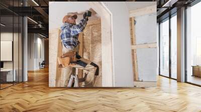 General Construction Contractor Worker Attaching Drywall Using Drill Driver Wall mural