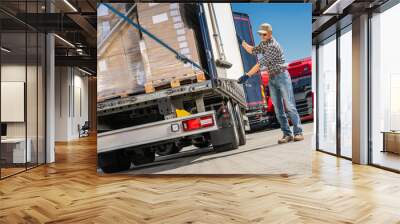 Trucker Loading Cargo Boxes Into Truck Wall mural