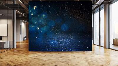 background of abstract glitter lights. blue, gold and black. de focused Wall mural