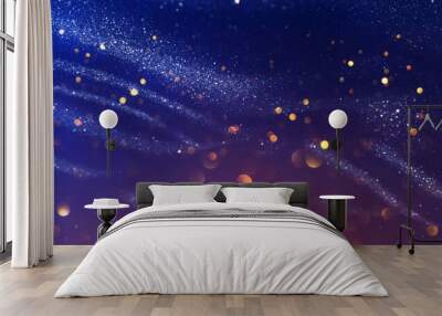 background of abstract glitter lights. gold, blue and black. de focused Wall mural