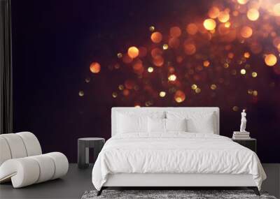 background of abstract glitter lights. gold and black. de focused Wall mural