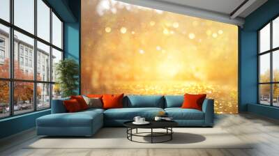 blurred abstract photo of light burst among trees and glitter golden bokeh lights Wall mural