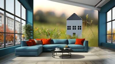 Concept image of a small house in nature. Idea of ecology, solar energy, and sustainability Wall mural