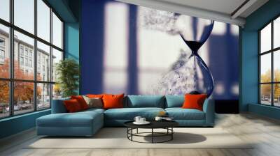 Hourglass as time passing and pass away concept. Wall mural