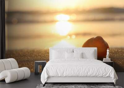 image of sandy summer beach and seashell at sunset light Wall mural