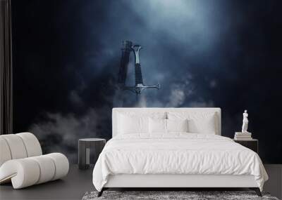 mysterious and magical photo of silver sword over gothic black background with smoke. Medieval period concept Wall mural