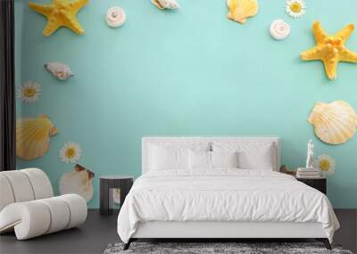 nautical concept seashells and starfish over mint blue wooden background Wall mural