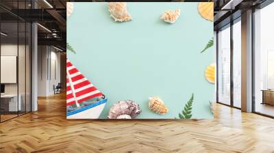 nautical concept seashells and starfish over mint blue wooden background Wall mural