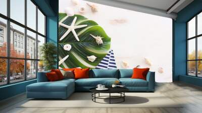 nautical concept with white decorative sail boat, seashells over wooden background Wall mural