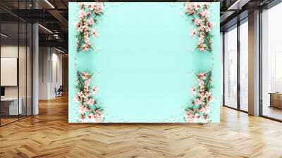 photo of spring white cherry blossom tree on pastel mint wooden background. View from above, flat lay Wall mural