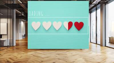 Valentine's day concept. red chocolate hearts over blue wooden background. Love loading concept Wall mural