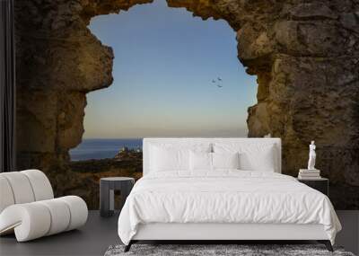 Fort at sunrise on the coast of Cagliari in Sardinia Wall mural