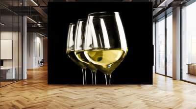 three glasses of white wine on black background Wall mural