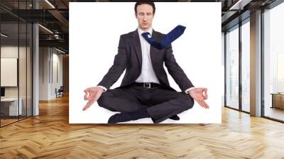 young businessman meditating in yoga lotus pose on white backgro Wall mural