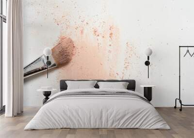 pink make up spilled over white surface with make up brush covered in powder Wall mural