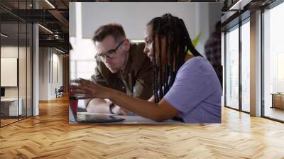 Creative business people planning and brainstorm with laptop computer in modern office. Wall mural