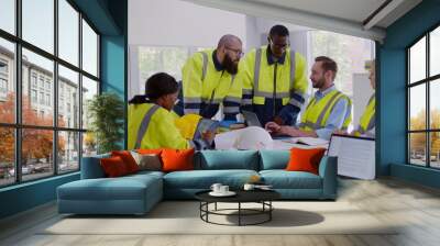 Multiracial engineers team meeting for architectural project in office Wall mural