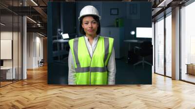 Portrait of African-American woman engineer in safety vest and helmet Wall mural