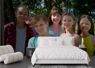 Portrait of multi-cultural children hanging out in countryside together Wall mural