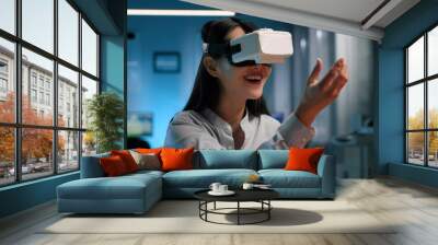 Young businesswoman engineer working on project in vr headset.  Wall mural