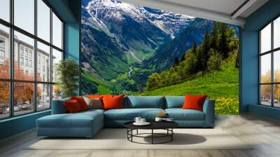 Looking down into the valley between the snow capped mountains Wall mural