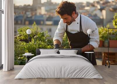 A chef harvesting fresh herbs from a rooftop garden, with a cityscape in the background Wall mural