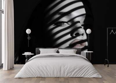 A young model with light coming through the window showing on her face. Wall mural