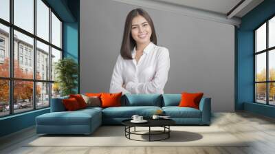 Beautiful Business Woman smiling on grey background Wall mural